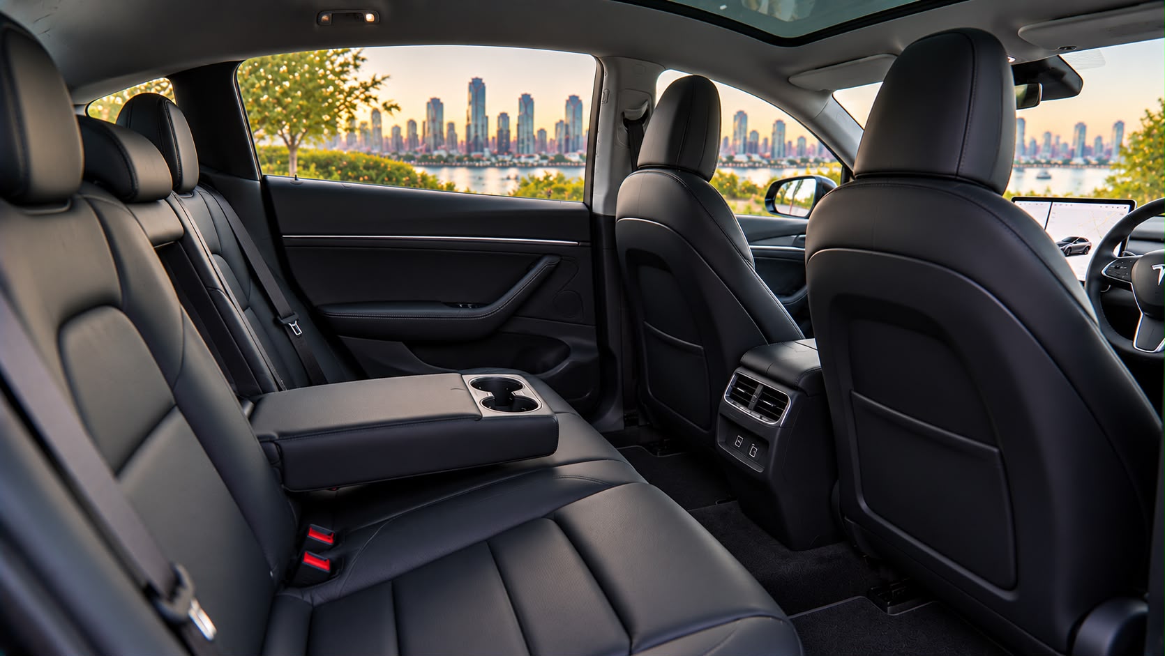 Tesla Model Y minimalist black interior with panoramic glass roof